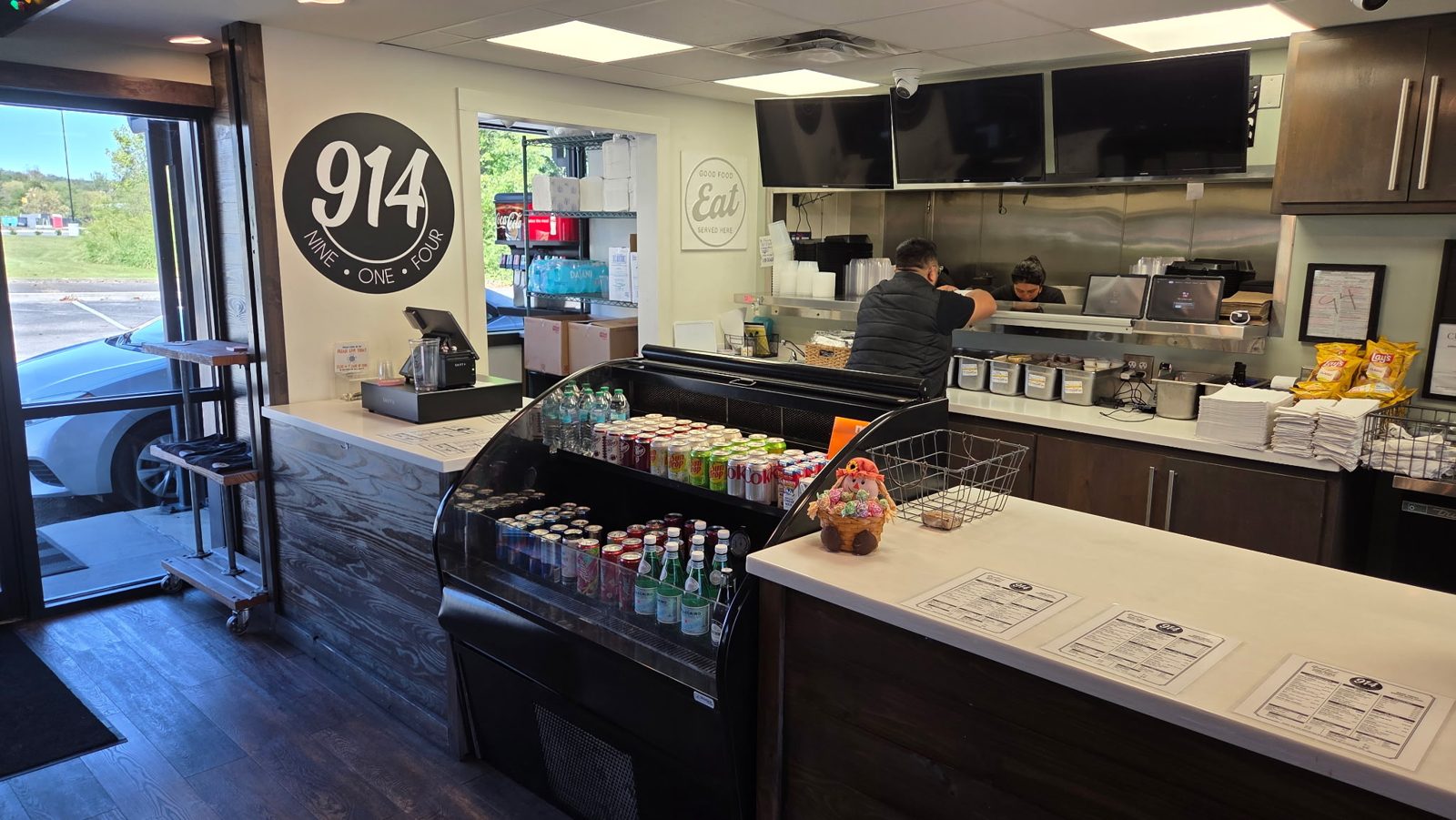 The Nine One Four counter with cold drinks and the open kitchen