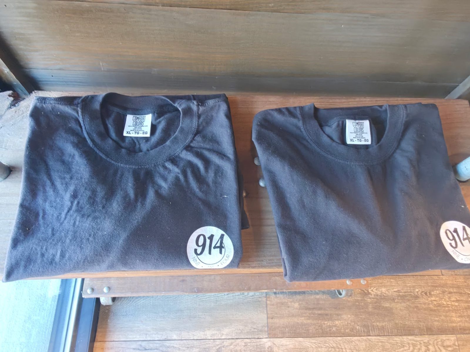 Black Nine One Four t-shirts with the round 914 logo